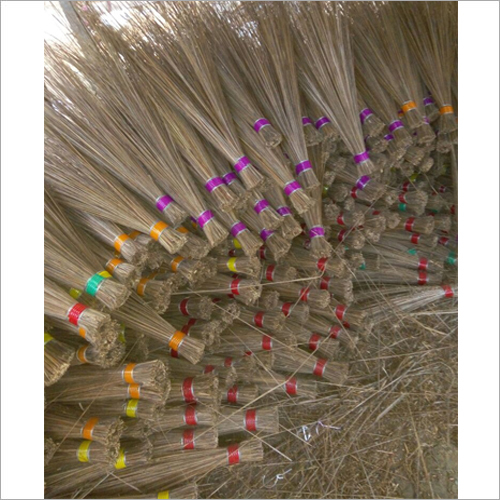 Finished grass brooms with colour bands