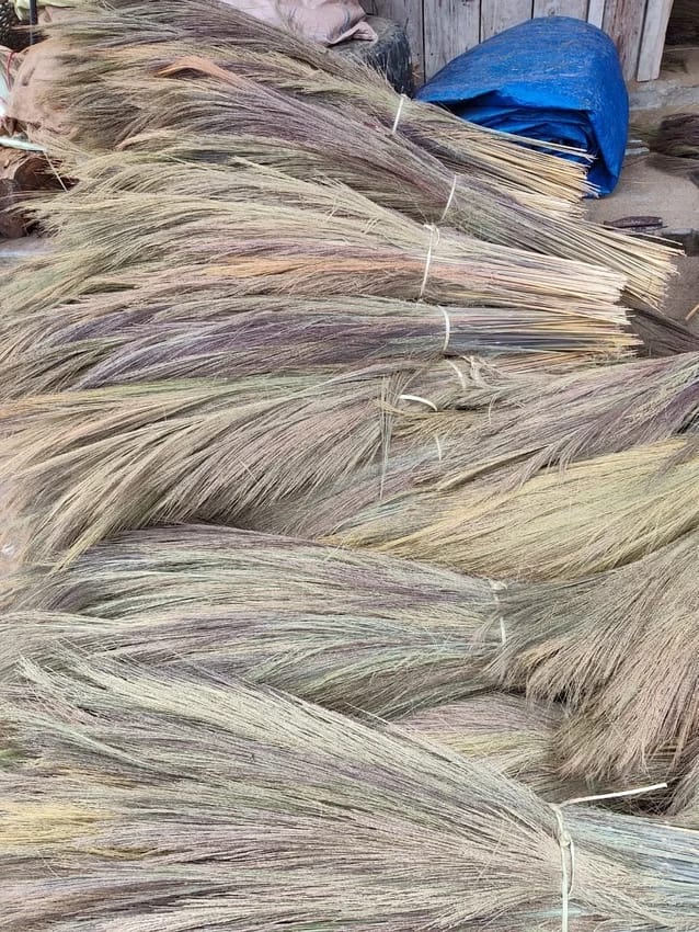 Grass broom heads pile