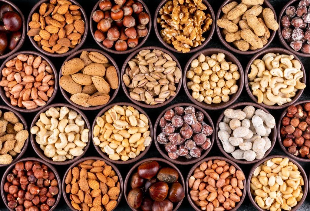 Mixed nuts in bowls — Sun Savera Wellness